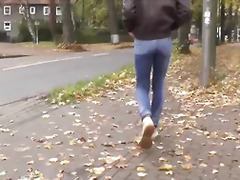 pissing in jeans on public road