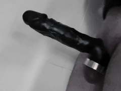 Playing with cock extension in bath