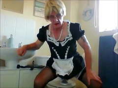 Sissy ken in maids uniform rides dildo around the house